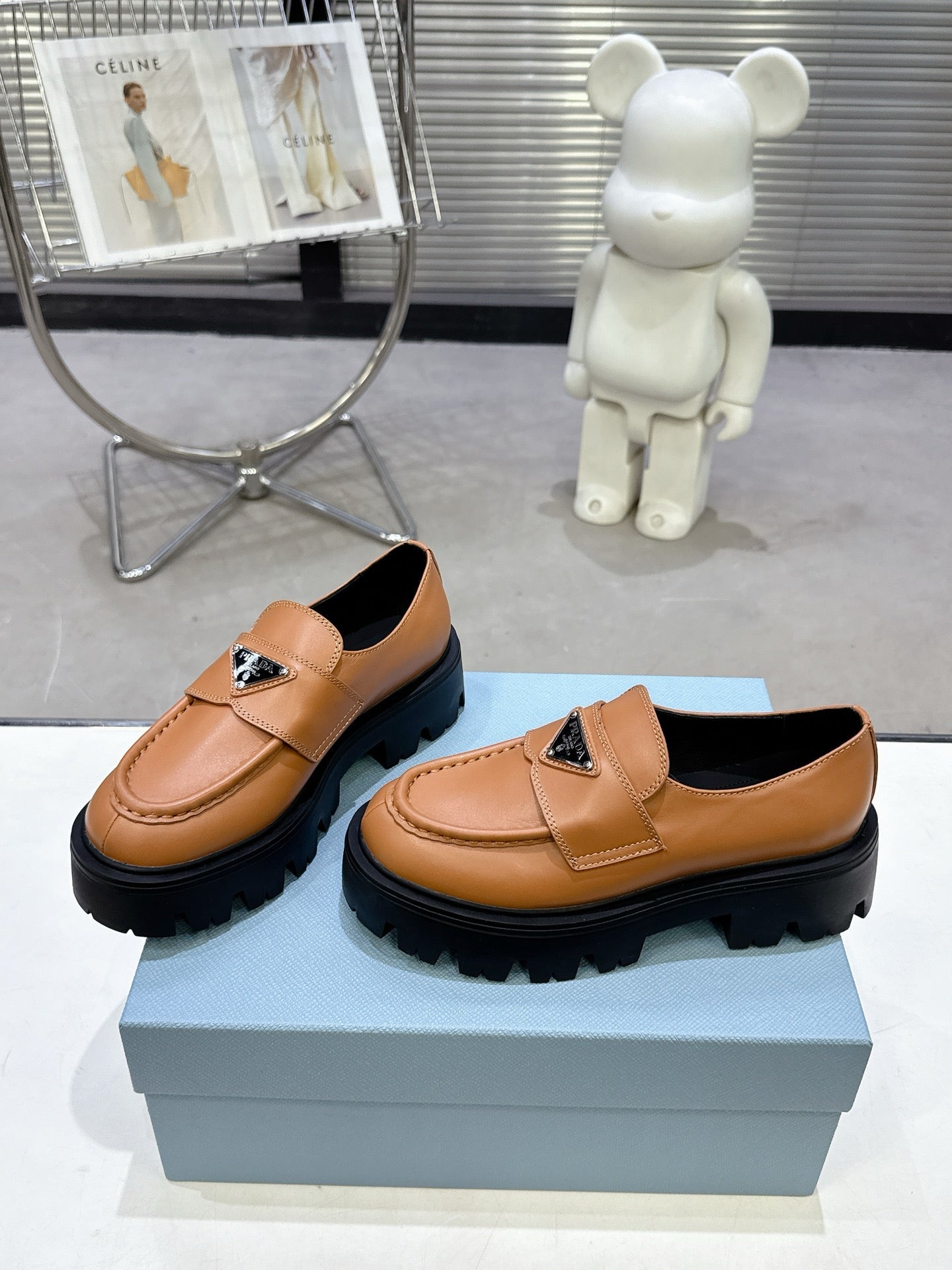 PRADA 25S THICK-SOLE LOAFERS 60 MM IN COGNAC BROWN CALFSKIN