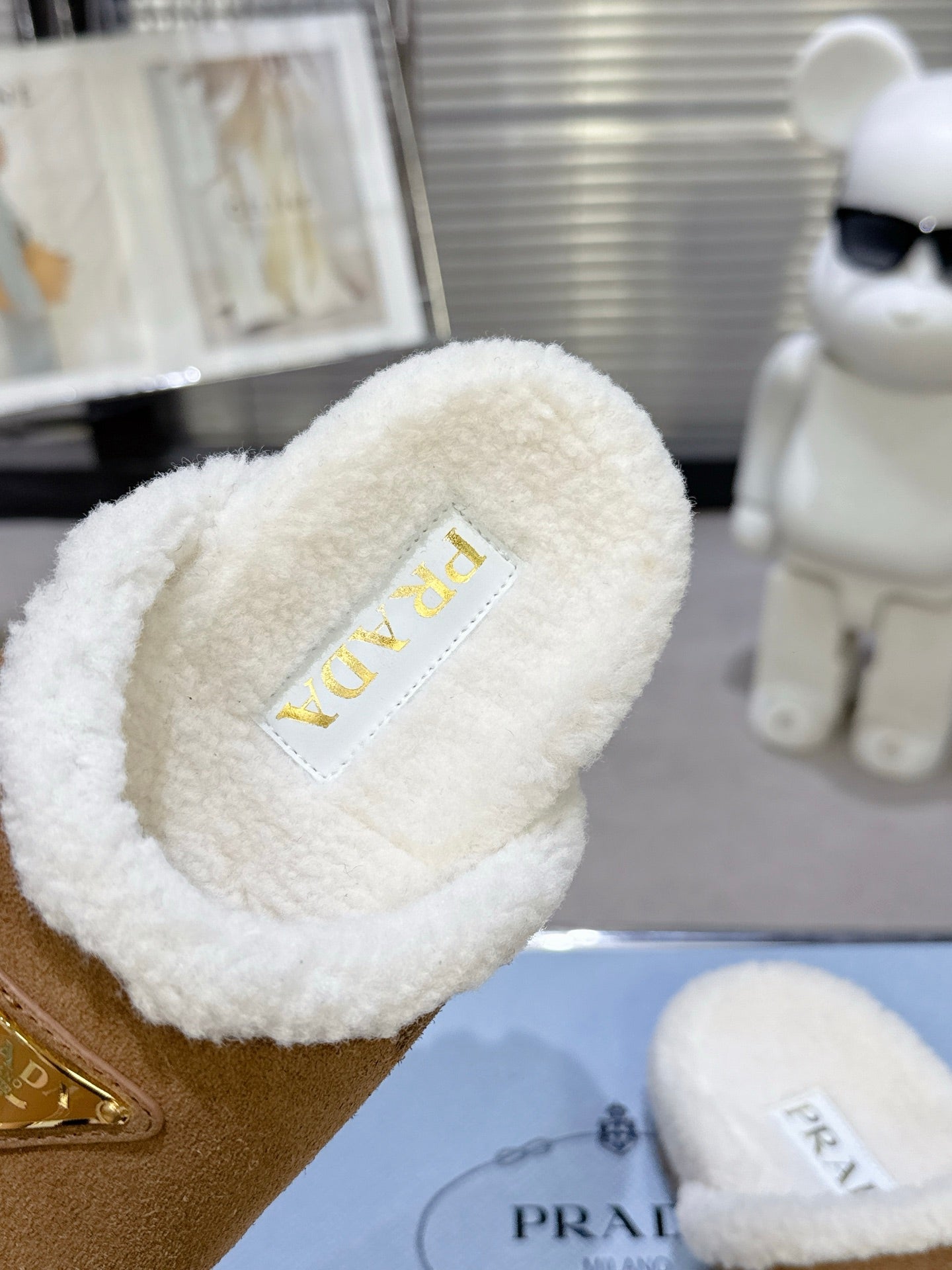 PRADA 25S FUR-LINED MULES IN BROWN SUEDE