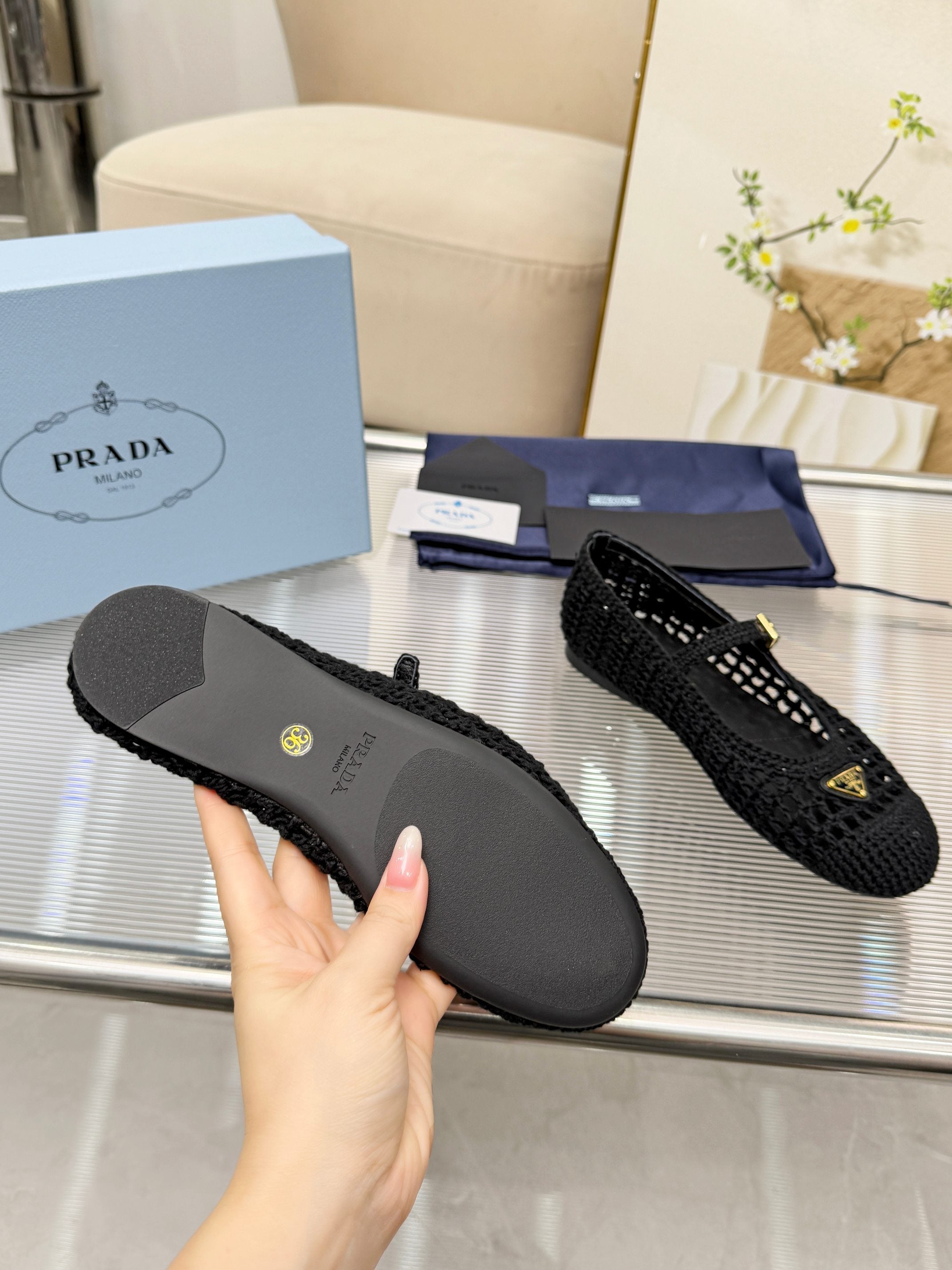 PRADA 26S MARY JANE FLATS IN BLACK WOVEN RAFFIA WITH TRIANGLE LOGO