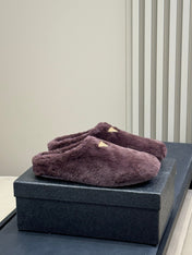 PRADA 25S CLOGS IN WINE RED SHEARLING